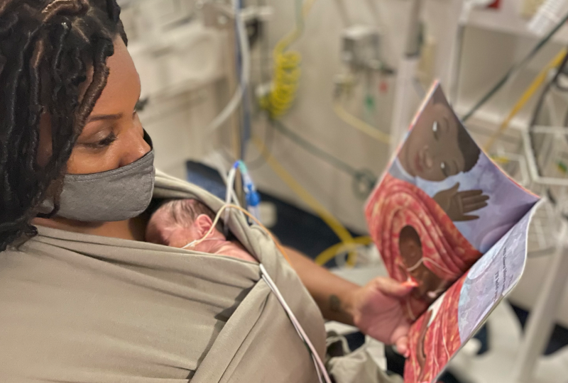 mom kangaroo care with newborn in NICU